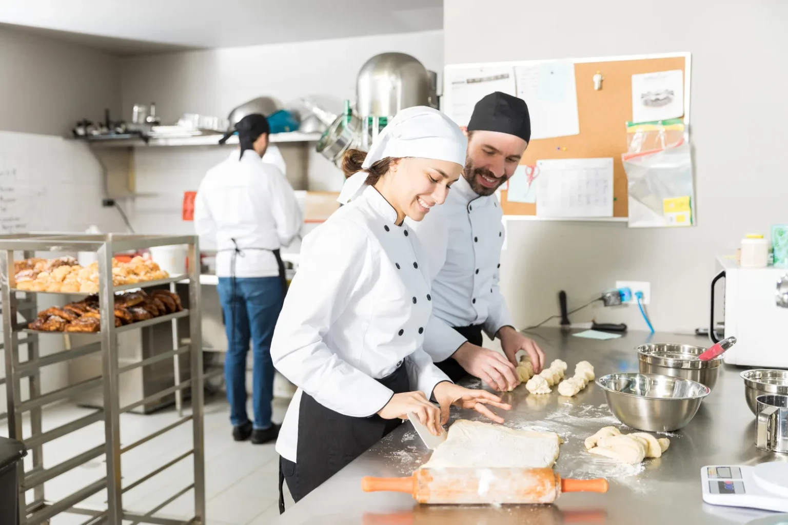 Bakers preparing dough while learning bakery course fees value